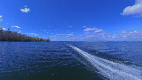 Boat wake foaming at water from outboard motor rear view. Waves from the ou.. Stock Footage 346310351