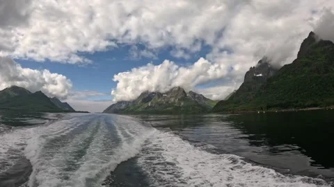 Boat wake on left side navigating scenic mountain fjord in Lofoten Stock Footage 344753128