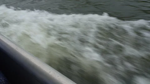 Boat Wake Moving Forward Through Water, View from Deck Looking Down Stock Footage 314923328