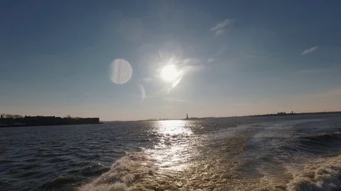 Boat wake in River East during a sunny day Stock Footage 71558094