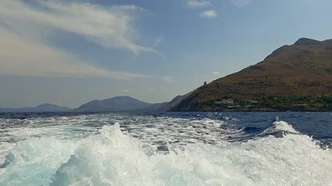 Boat wake trail with Riserva dello Zingaro, slow motion pov 動画素材 278953679