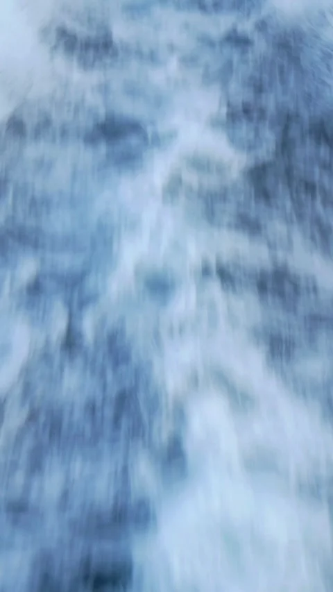 Boat wake trailing through open ocean, showcasing journey and movement across Stock Footage 281582719