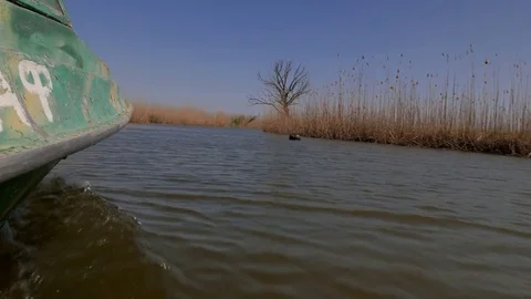 The boat is walking along the river. Shoot from a low point. Stock Footage