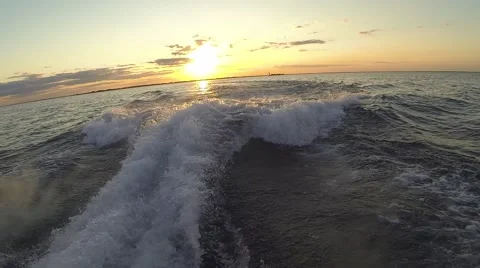 Boat Wash During Sunset Overlooking the Lake on Beautiful Evening Stock Footage 47476901