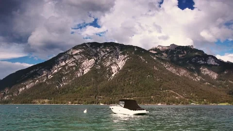 Boat on the water in the background of the mountains. Stock Footage 90360335