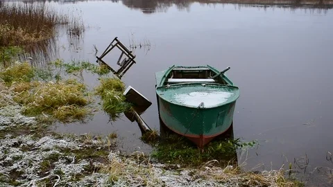 Boat on the water, first snow Stock Footage 118907533