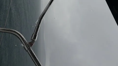 A boat is on the water with a storm in the background Video stock 274031927