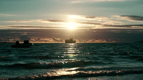 Boat on water at sunset Stock Footage 200827463