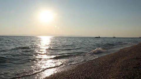 Boat on waves in the light of sunrise Stock Footage 129090448