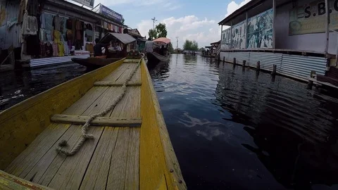 Boat Weaving Through Storefronts Stock Footage 107636243