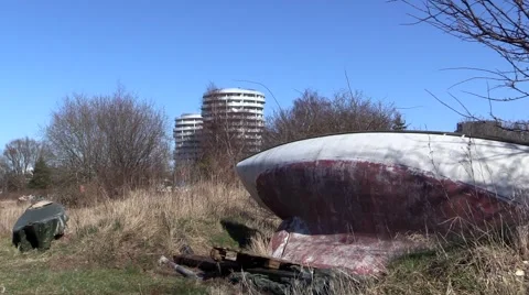 Boat wreck in front of newly built residential building 스톡 동영상 47892925