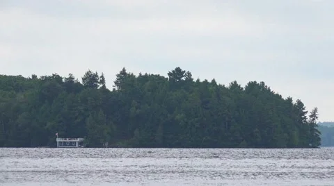 Boathouse on Distant Shore Stock Footage 52488522