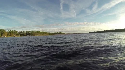 Boating on a blue lake Video stock 45446848