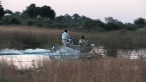 Boating by Hippos - Part 1 Stock Footage 8997838