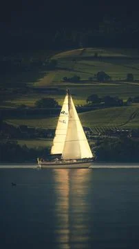 Boating on a Lake - sunset backlit - vertical Stock Photos