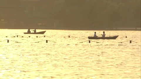 Boating on the lake at sunset Stock Footage 253772434