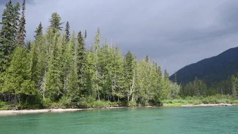 Boating plate, on river in Wells Gray Park with mountains, green water, 4k Stock Footage 247093287
