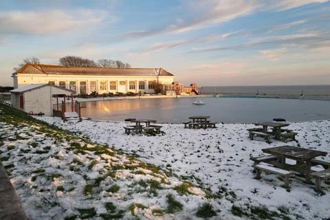 The boating pool building catching the sunset on a winter eveing. Stock Photos