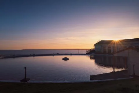 The boating pool in Ramsgate, Kent, UK at sunset with Sandwich Bay Stock Photos