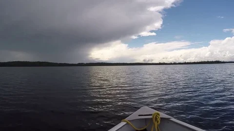 Boating in to a storm front Stock Footage 77808972