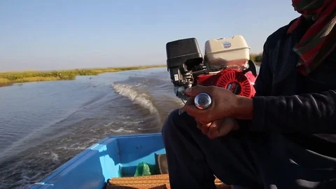 Boatman guy steers engine at sea of pink lotus at Udon Thani Thailand. Stock-Footage 78348083