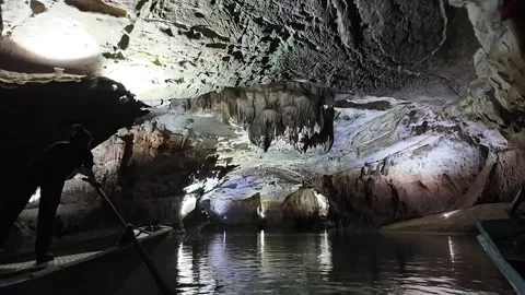 Boatman rowing boat move inside Phong Nha Ke Bang cave at National park Stock Footage 277981751