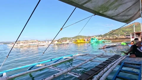 Boatmen Resting at the Side of the Boat While Docking Stock Footage 234389994