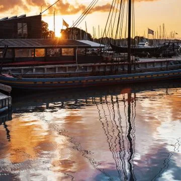 Boats and clouds reflection Stock Photos