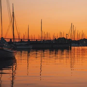 Boats and clouds reflection Stock Photos