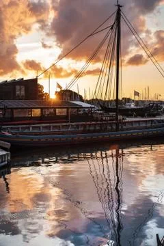 Boats and clouds reflection Stock Photos