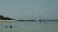 Boats and tourists at the Bali beach HD Footage