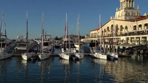 Boats and yachts in front of main building of Marine Station. Sochi seaport. Stock Footage 145273575