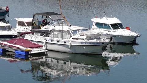 Boats and yachts moored in marina slow motion Stock Footage