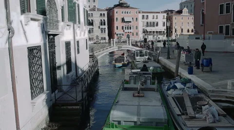 Boats attempt to pass each other in Venice canal Stock Footage 49360396