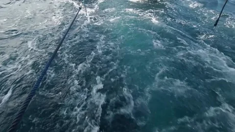 Boats bouncing on waves, being towed between islands, Raja Ampat Stock Footage 130433677