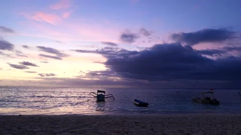 BOATS WITH CLOUDS AND SUNSET BEHIND Stock Footage 221666367