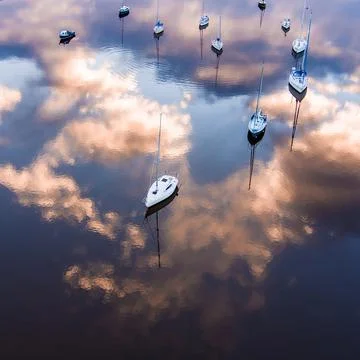 Boats in the Clouds Stock Photos