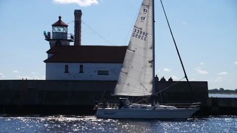Boats Crossing infront of Duluth Light House Stock Footage 87578094