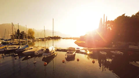 Boats dock. fly over. sunset lake view. aerial view. sunshine magic hour Video stock 38231491