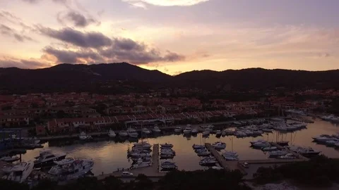 Boats docked at marina during sunset. Stock Footage 82401059