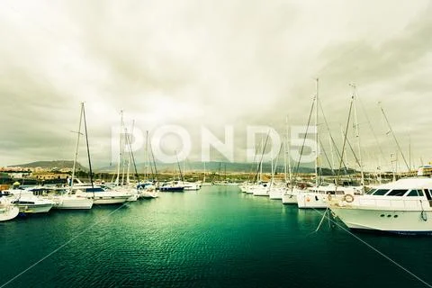 Boats docked at the Yacht Club, vintage style photography. Stock Photos