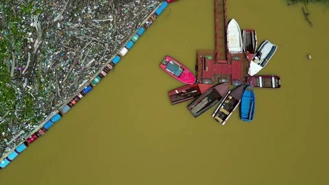 Boats on the Drina river. Garbage floating on the river. Stock Footage 264766117