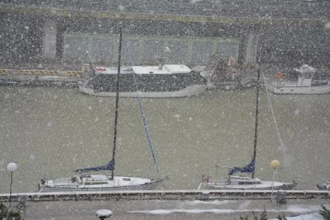 Boats during snowfall Stock Photos