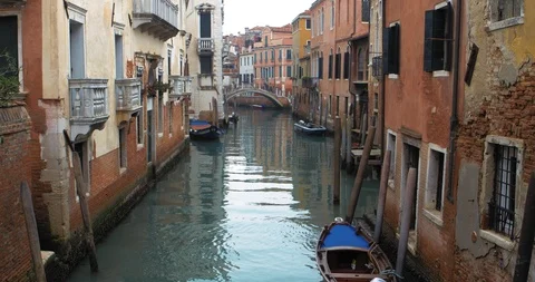 Boats float on back canals in Venice Italy. Shot filmed in 4k 2160p Stock Footage 119909344