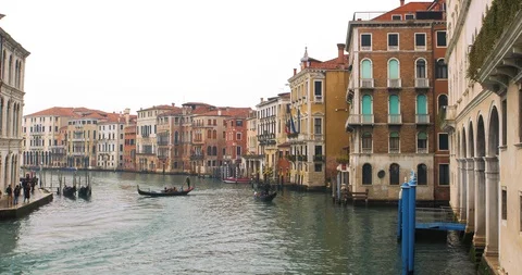 Boats float on back canals in Venice Italy. Shot filmed in 4k 2160p Stock Footage 120415400