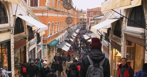 Boats float on back canals in Venice Italy. Shot filmed in 4k 2160p Stock Footage 120416464