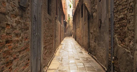 Boats float on back canals in Venice Italy. Shot filmed in 4k 2160p Stock Footage 120417502