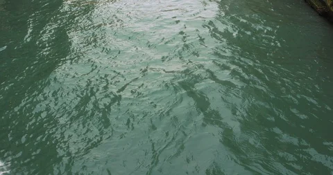 Boats float on back canals in Venice Italy. Shot filmed in 4k 2160p Stock Footage 120417728