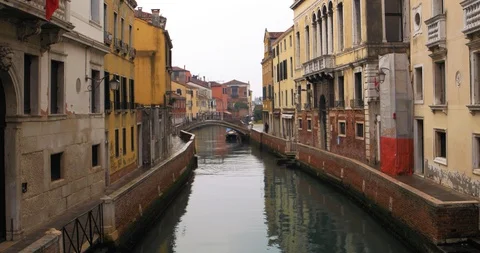 Boats float on back canals in Venice Italy. Shot filmed in 4k 2160p Stock Footage 120418316