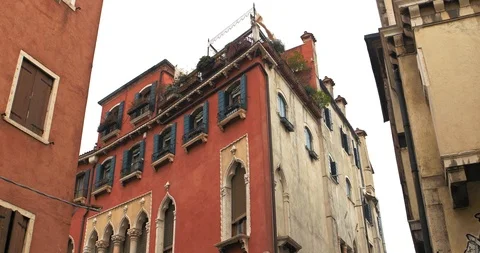 Boats float on back canals in Venice Italy. Shot filmed in 4k 2160p Stock Footage 120419230